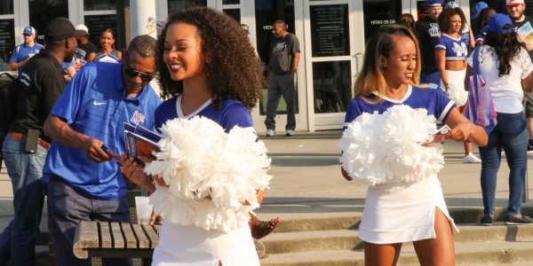 U of M Cheer Squad handing out flyers.